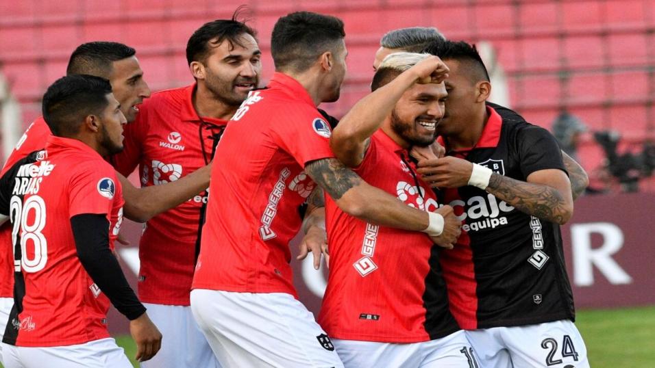 Melgar players celebrate a goal